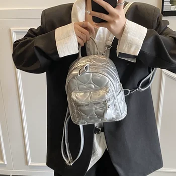 2025 Zaino in argento di nuova moda per donna Borse da scuola per studenti con motivo a cuore versatile Zaino da viaggio alla moda per ragazze