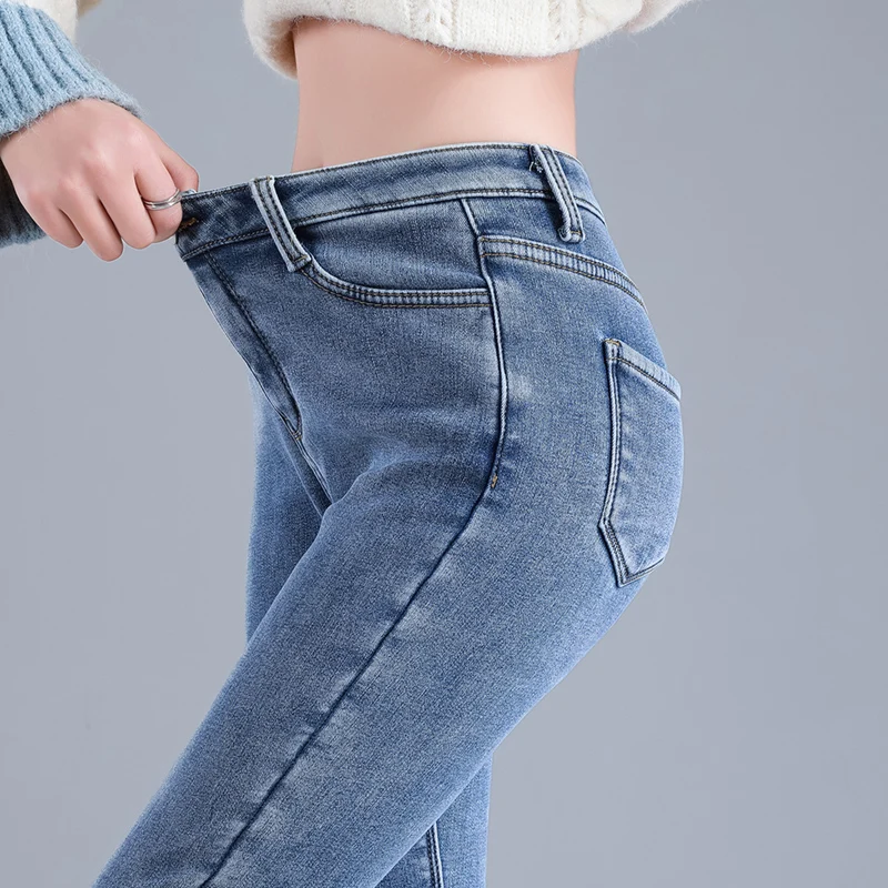Side profile showing the slim fit pencil pants silhouette.
