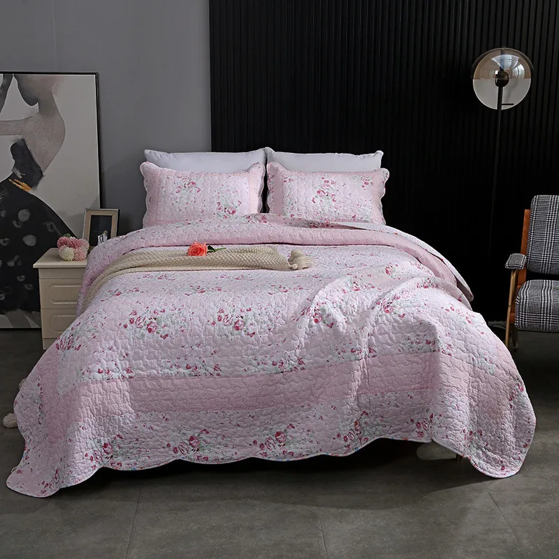 Padded Pink Cotton Quilted Bedspread on the Bed with Shams Hand