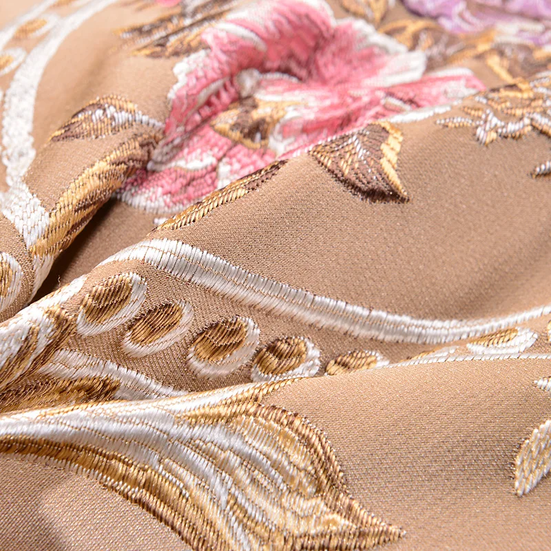 Close-up of floral embroidery and scrollwork