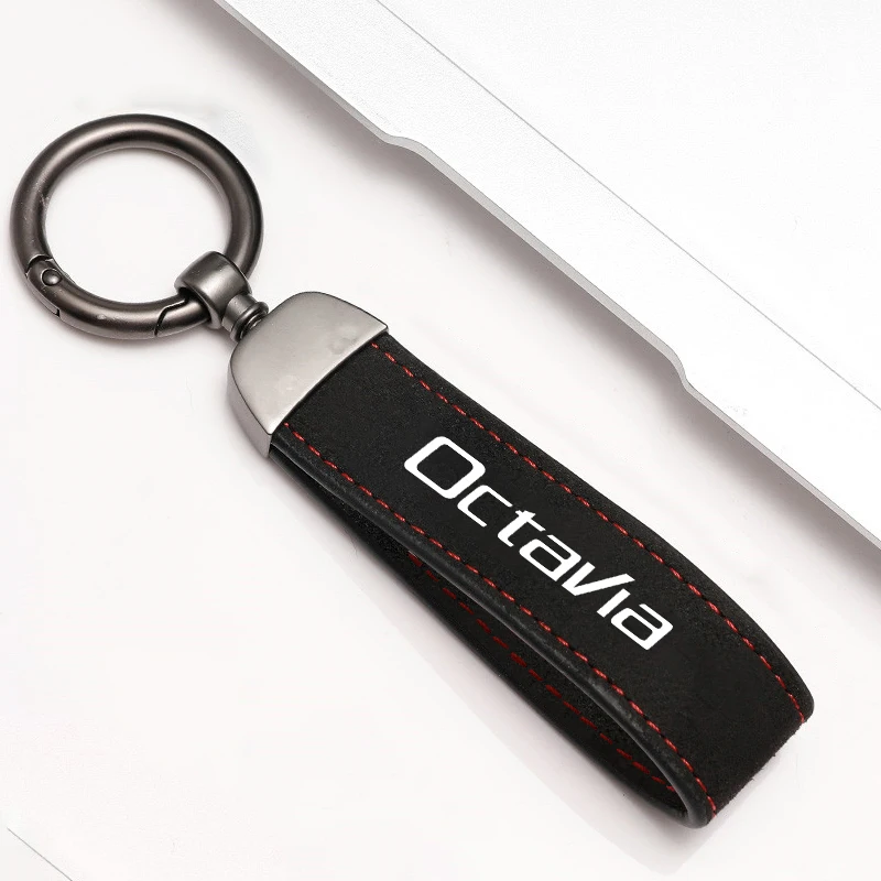 Elegant Metal and Suede Car Keychain with Emblem Design