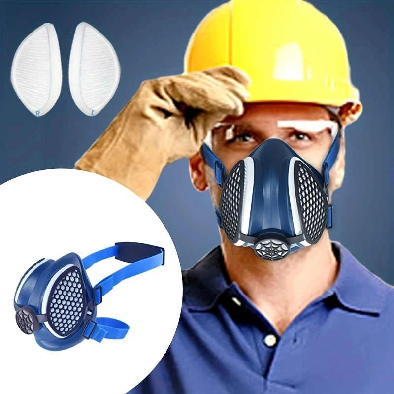 Demi-masque respiratoire en silicone posé sur une surface, avec filtres visibles, pour protection contre poussière de peinture.