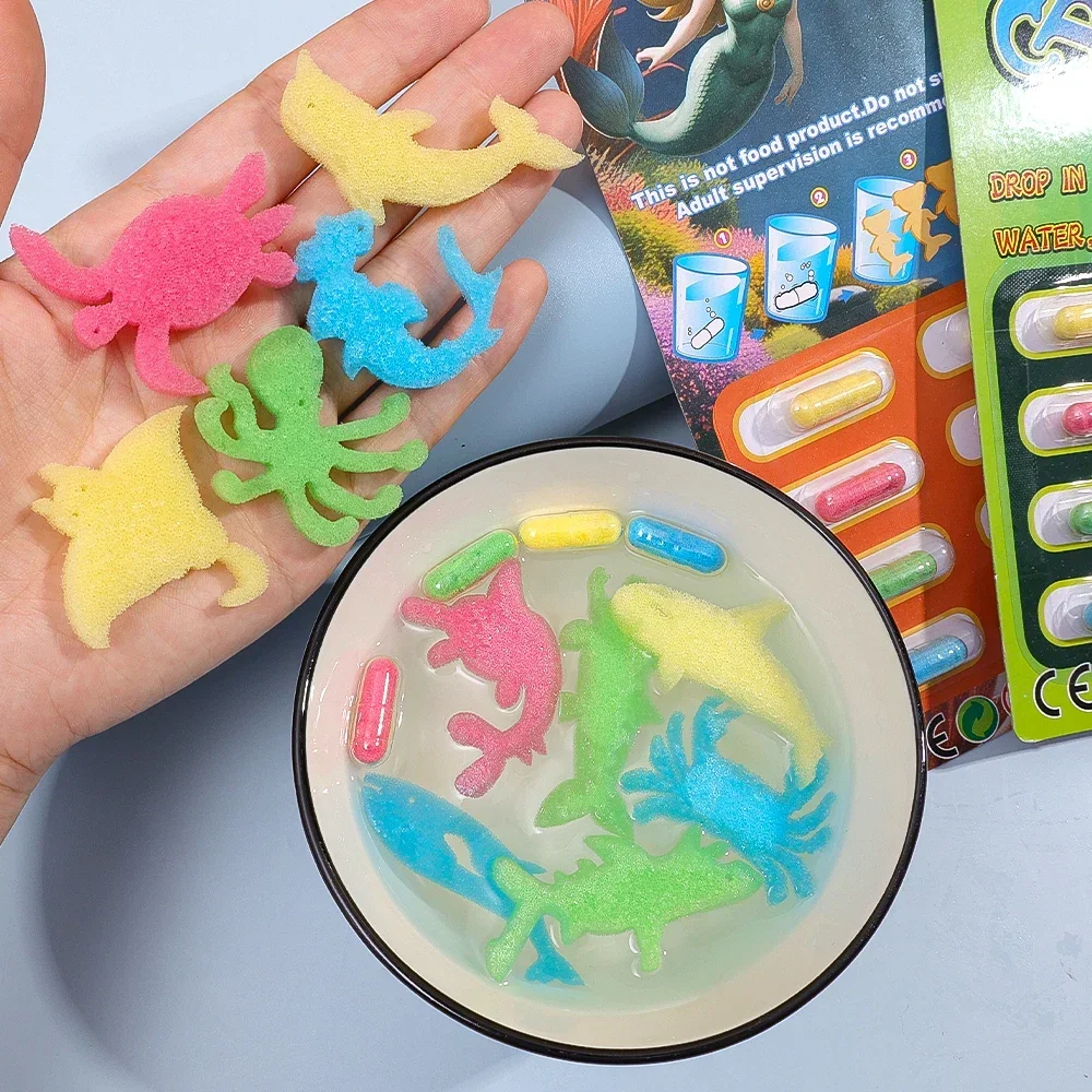 12PCS Children's Soaking Sponge Capsules Grow Toys Dinosaur Marine Creativity Toys Boys and Girls Water Playing Tools