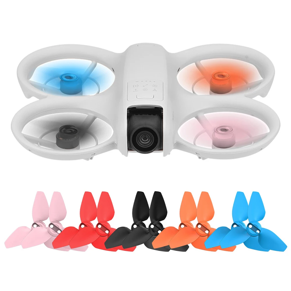 Paire d'hélices colorées pour DJI Neo, vue rapprochée des pales et du mécanisme de fixation.