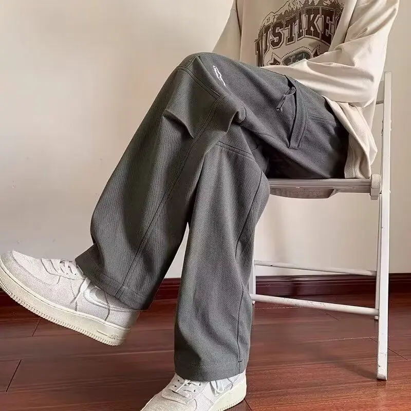 Abbigliamento da uomo autunno inverno coulisse tinta unita tasche elastiche a vita alta Casual pantaloni larghi comodi Boyfriend coreani 3