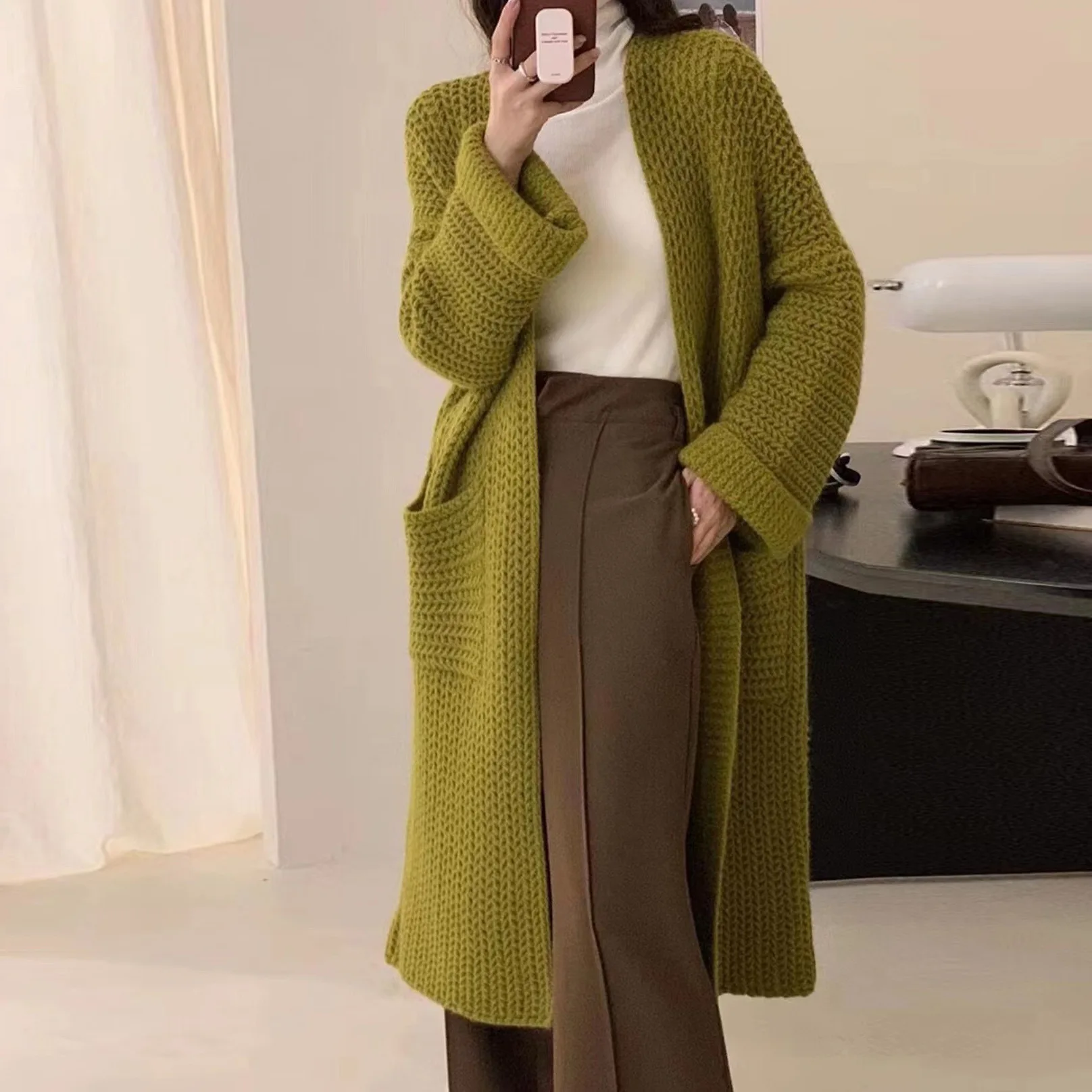 

Autumn and winter new lazy wind thick needle design sense V-neck pocket knitted sweater female Joker long coat