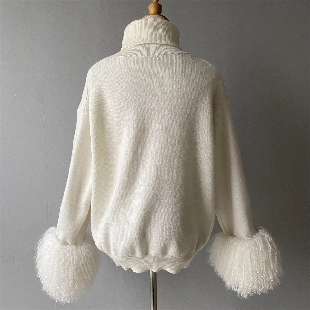 Removable faux fur cuffs close up on knit sweater