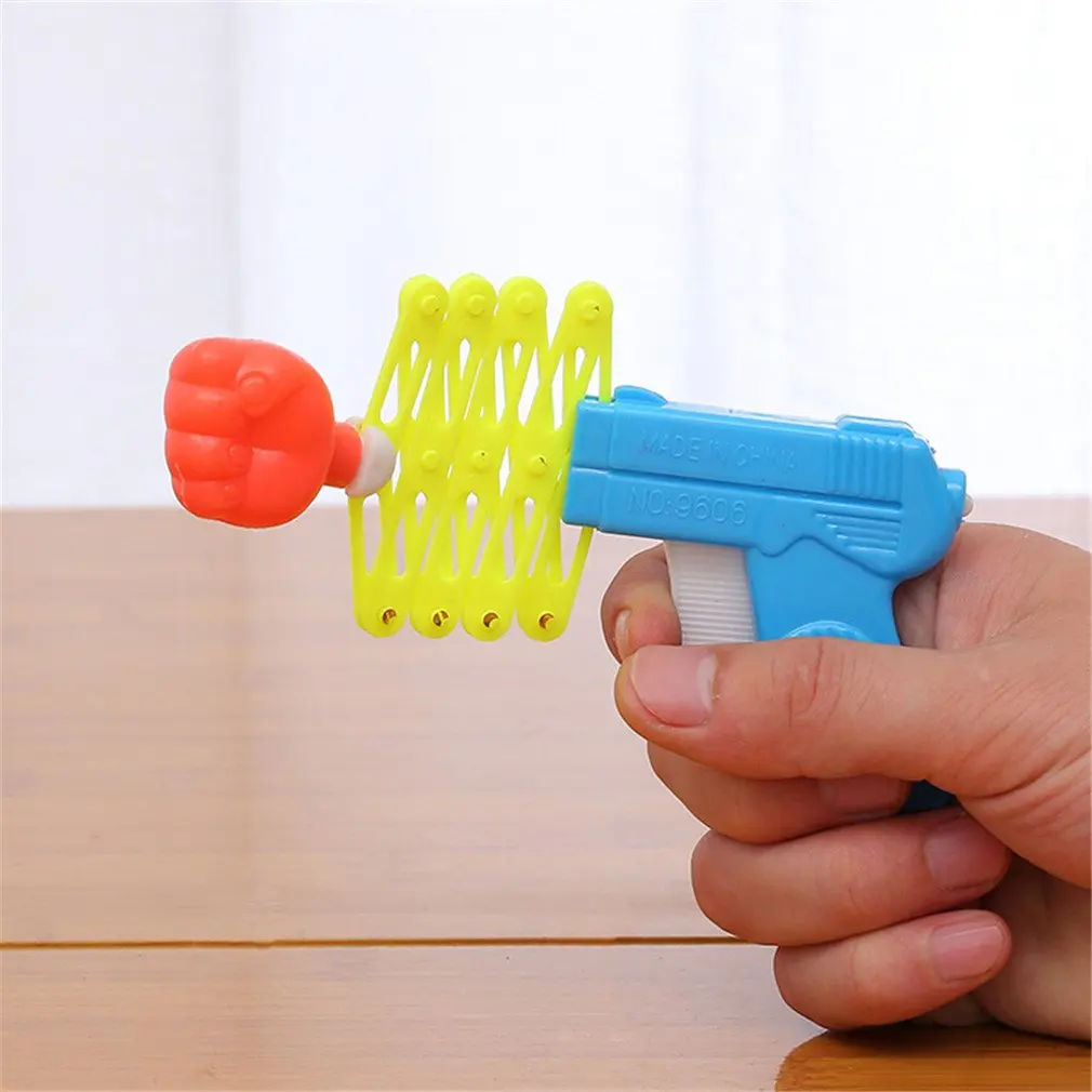 S9428f8f365c442188f1ca728c08a8d95u Hot Funny Retractable Fist Shooter Trick Toy Funny Child Kids Plastic Party Festival Gift Classic Elastic Telescopic Fist Toy