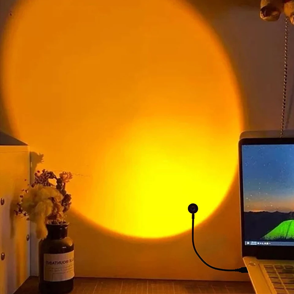 a laptop with usb chargeable sunset lamp on top of a wooden desk | Brookline Shop