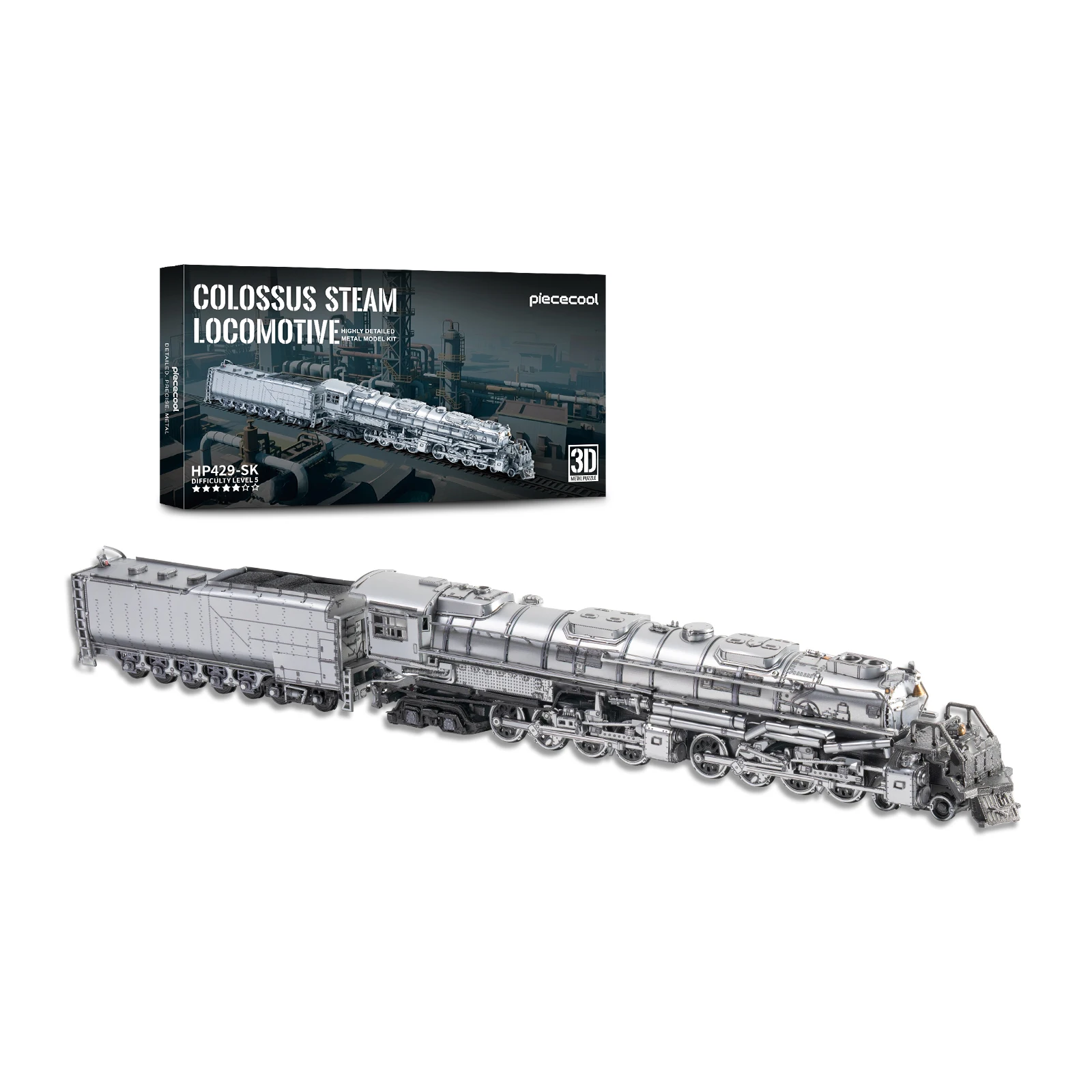 Gebouwd metalen stoomlocomotiefmodel met tender in zilverkleurig staal naast de verpakking