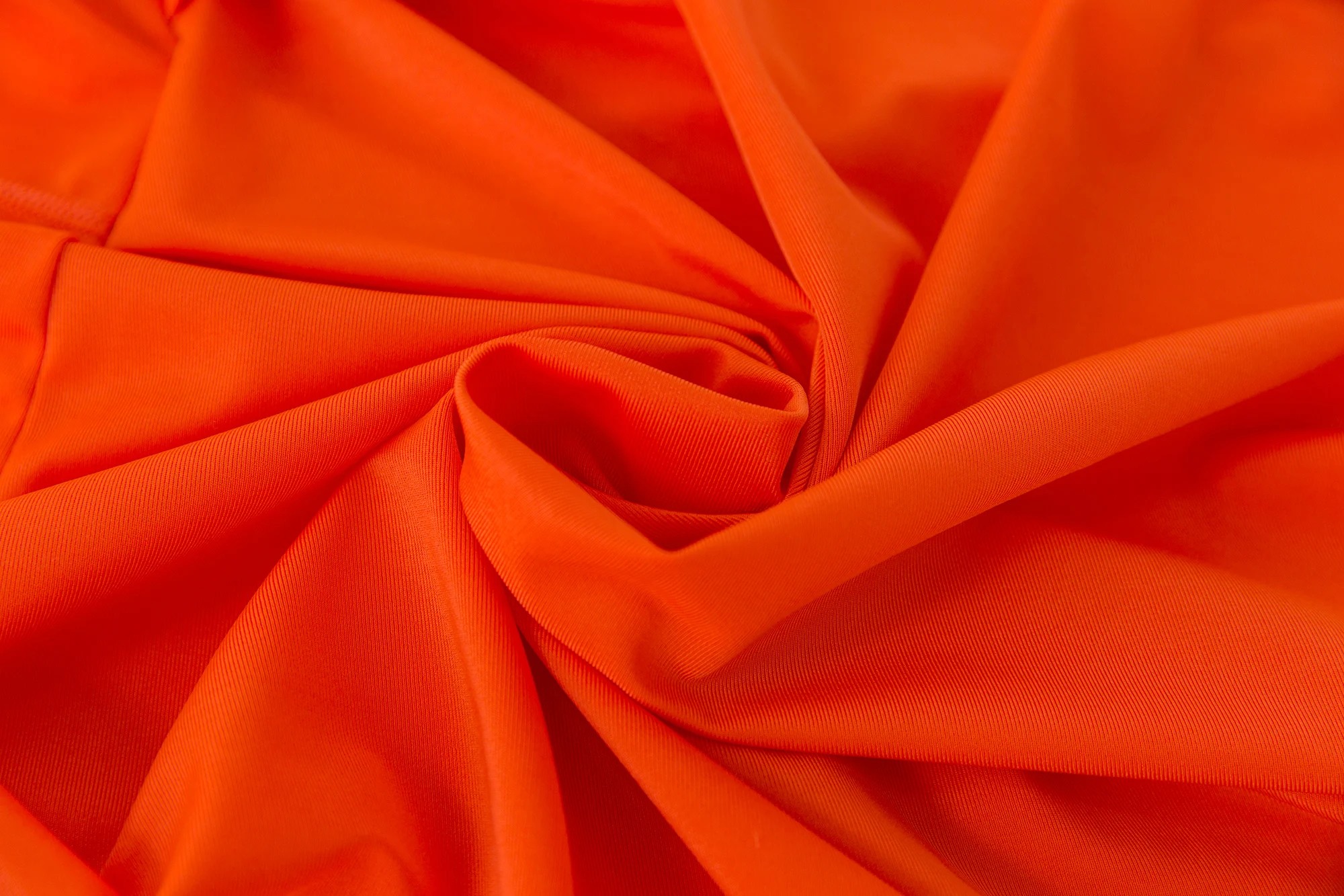 Folded burkini set with hijab, leggings, and bag displayed flat