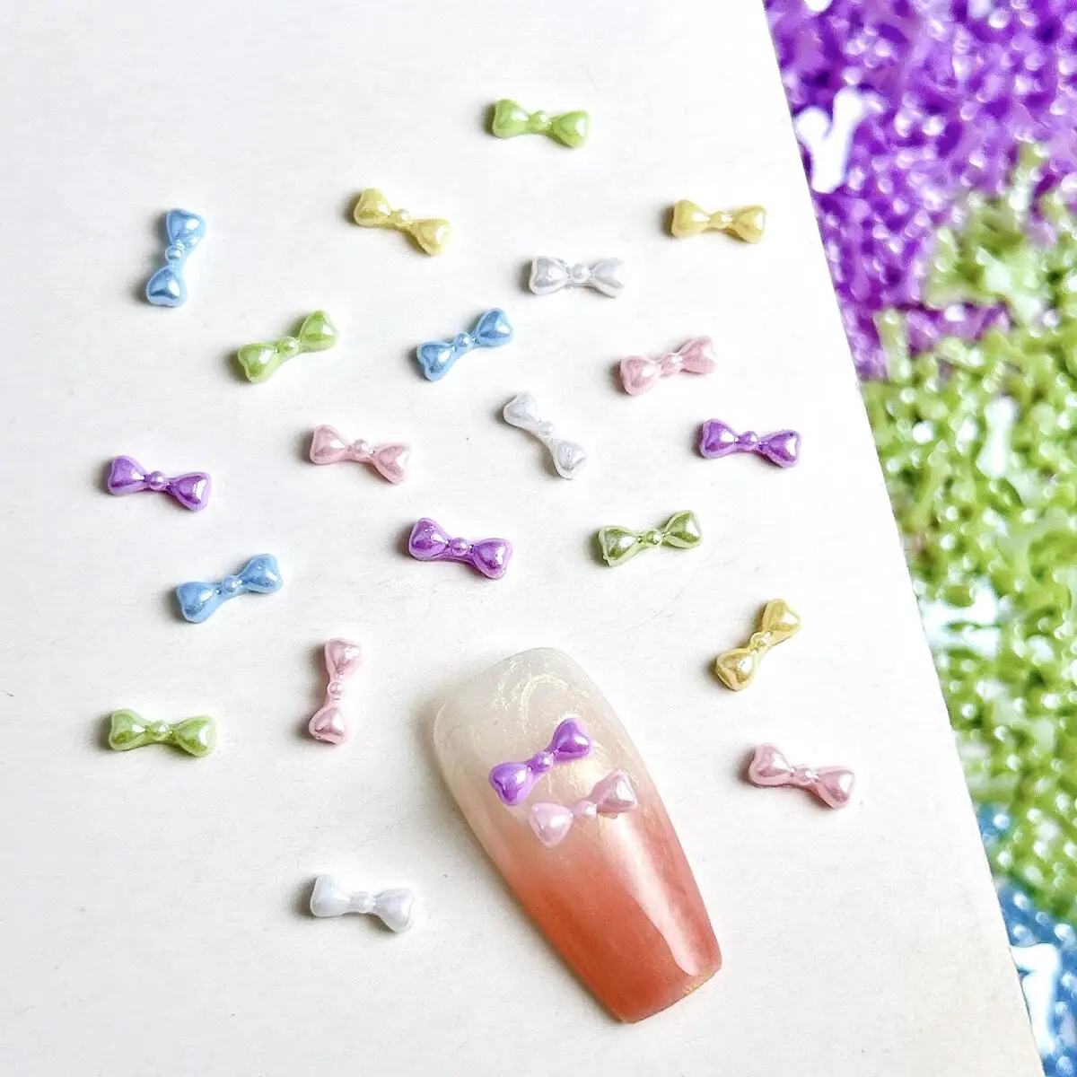 100개 마카롱 미니 펄 리본 레진 네일 참 장식, 창의적인 스위트 라인 리본 매듭 네일 아트 장식, DIY 요정 네일 부품