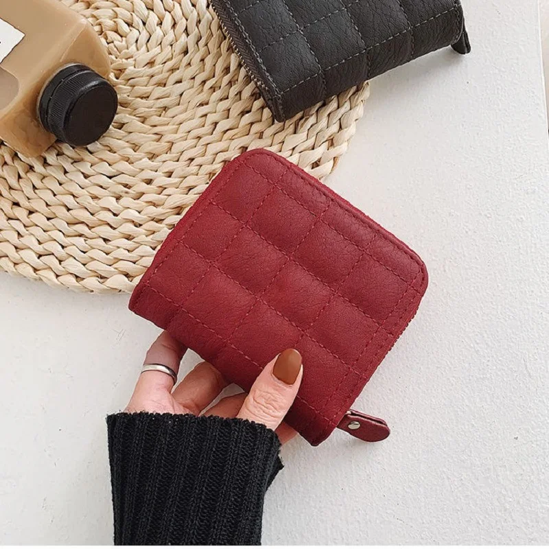 Elegant Women's Minimalist Leather Clutch with Embroidered Design