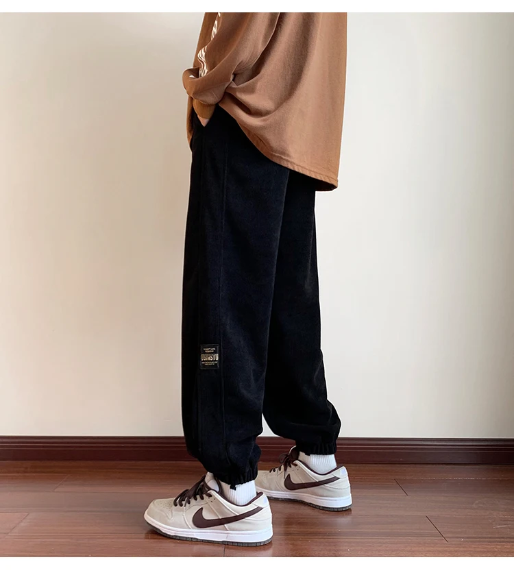 بنطلون رجالي جديد 2025 من قماش الكوردروي مبطن بالصوف فضفاض للعمل والرياضة في الخريف والشتاء مقاوم للتآكل ومضاد للأوساخ