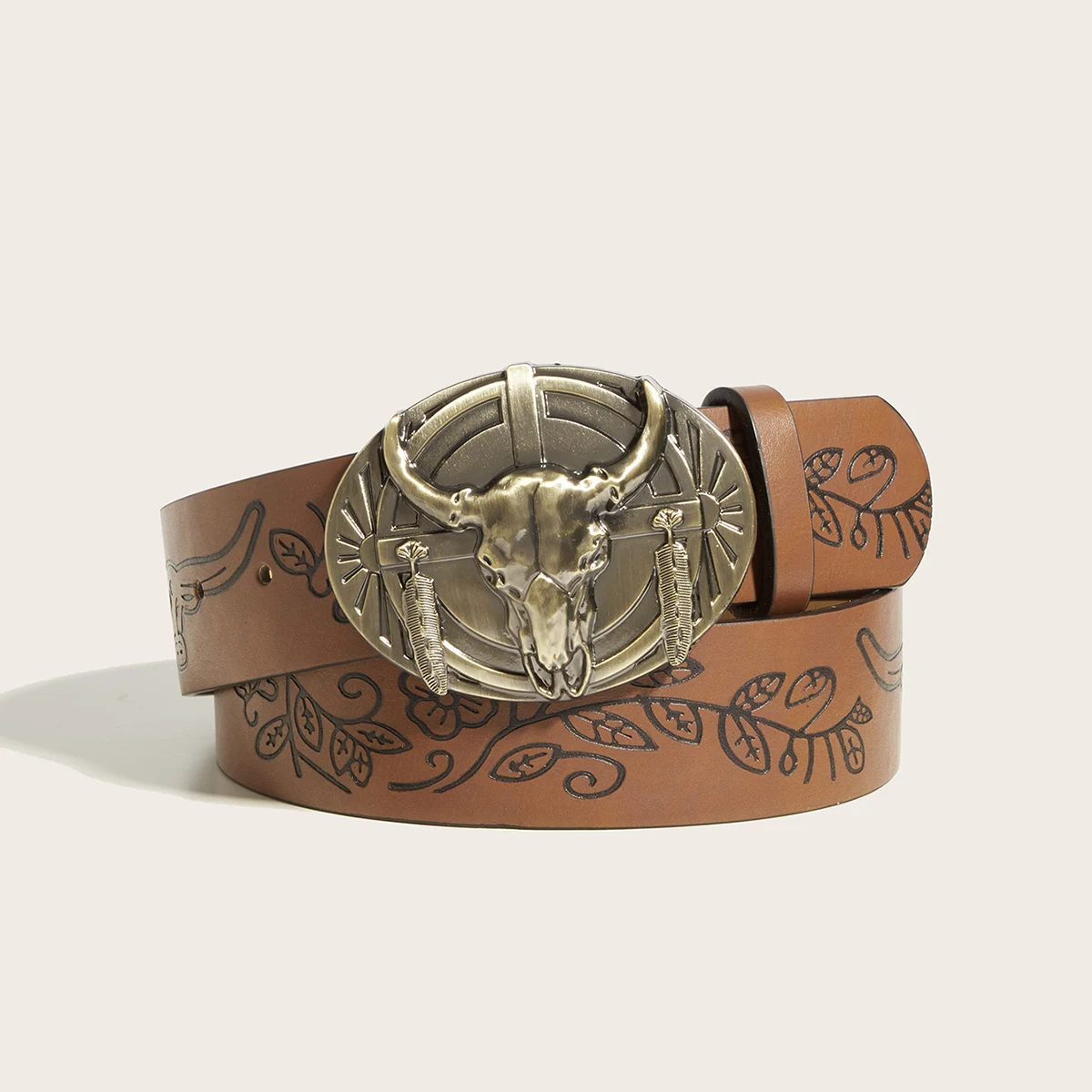 A leather belt with a buckle shaped like a cow's head in a western style, modern and casual.