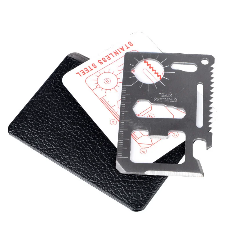 Hand holding stainless steel credit card multitool