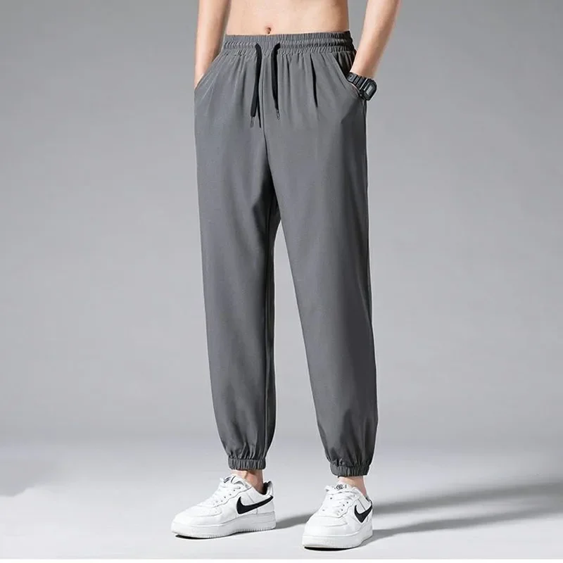 Ice Shreds Casual Pants Men 2024 Summer Thin Style Quick Drying Motion Solid Color Loose Bound Feet Nine Points Casual Trousers
