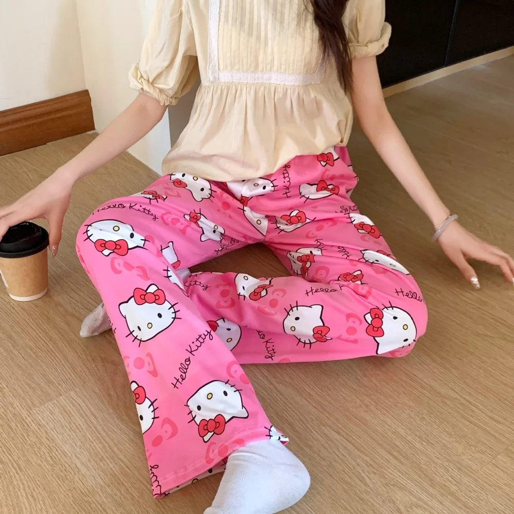 A pair of loose-fitting Hello Kitty pajama pants with a charming cartoon print pink 2