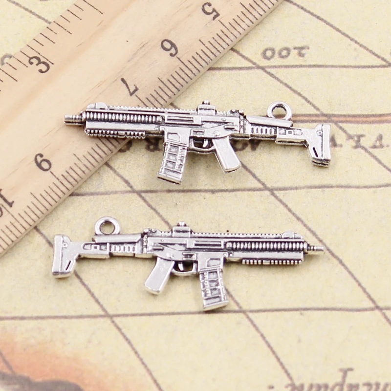 10 Stück Charms Maschinengewehr Sturmgewehr 40 x 15 mm Antik Silber Farbe Anhänger Herstellung DIY handgemachter tibetischer Schmuck