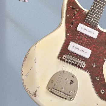 Vintage antique electric guitar, yellow 6-string, tremolo bridge, chrome hardware