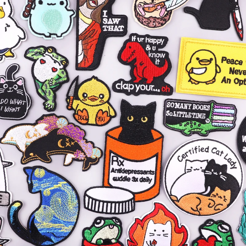 Cute embroidered animal patches featuring cats, frogs, dinosaurs, and ducks with funny quotes and expressive designs