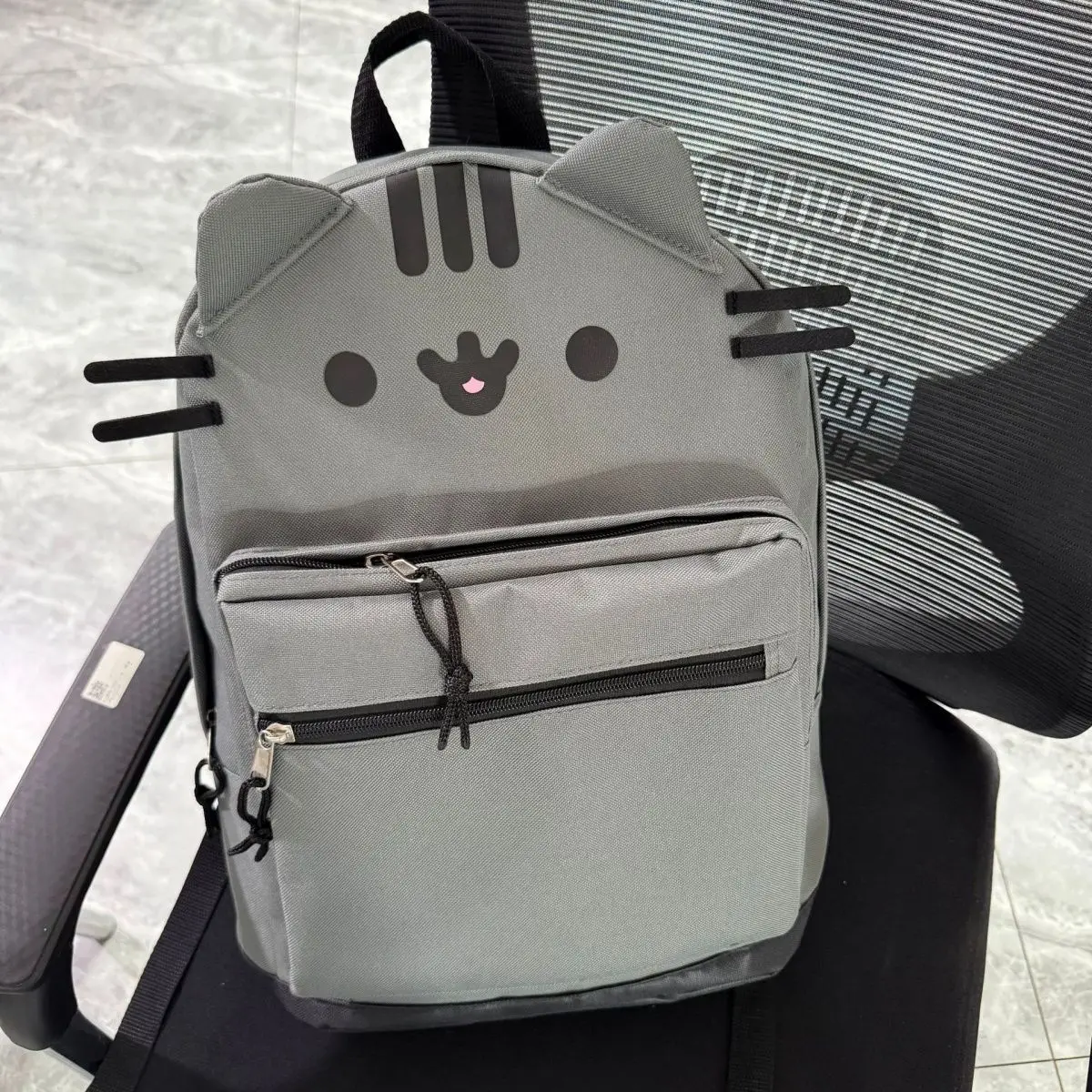 รูปสินค้า กระเป๋าเป้ลายแมวน่ารัก ช่องใส่ของครบ สะพายสบาย
