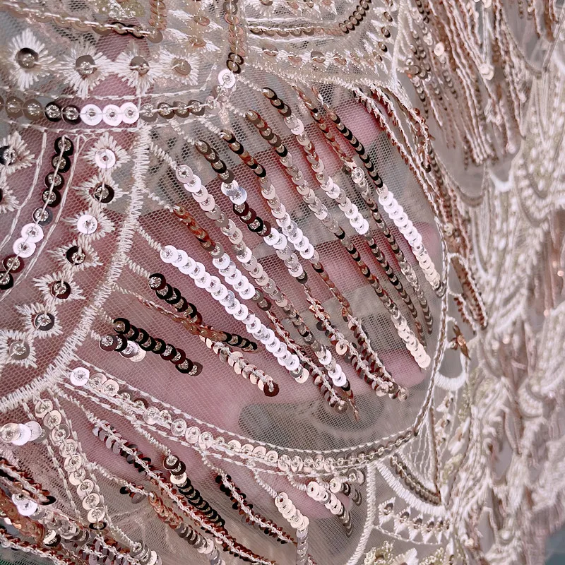 Кружевная ткань цвета шампанского золотого с пайетками и бахромой свадебная для