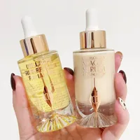 Charlotte Tilbury Magic Essence Crystal Essence Gloss à lèvres Super Vitamine C Hydratant Essence Transparente Nourrit et Raffermit la Peau 1