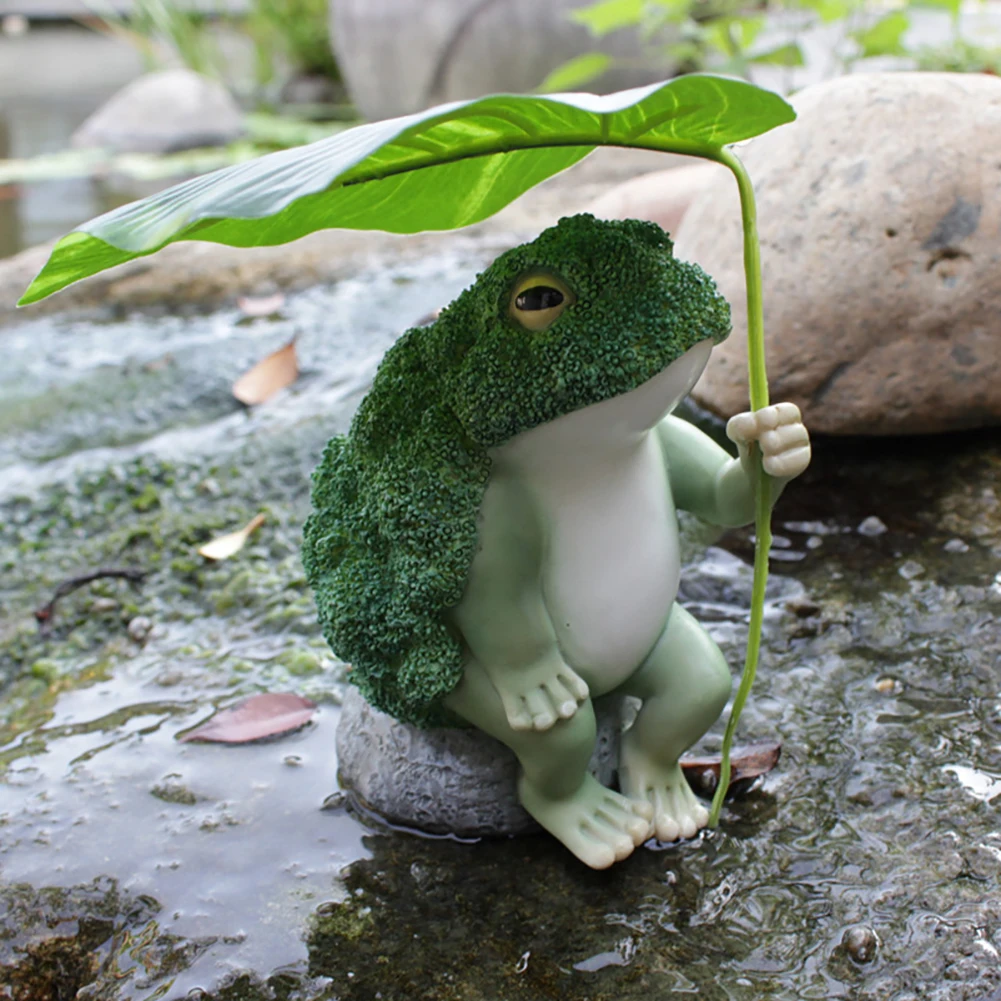 

Outdoor Frog Figurines Garden Resin Broccoli Frog Holding Lotus Leaf Sitting On Rock Sculpture Ornament for Patio Backyard Lawn