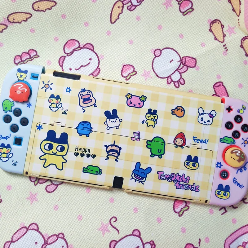 Funda protectora OLED con interruptor de dibujos animados Tamagotchi en Funda protectora OLED con interruptor de dibujos animados Tamagotchi en