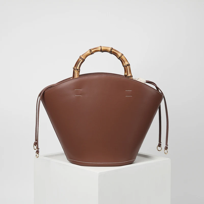 

2023 Spring/summer new leather large bucket bag caramel classic retro female bamboo handle portable handbag for women