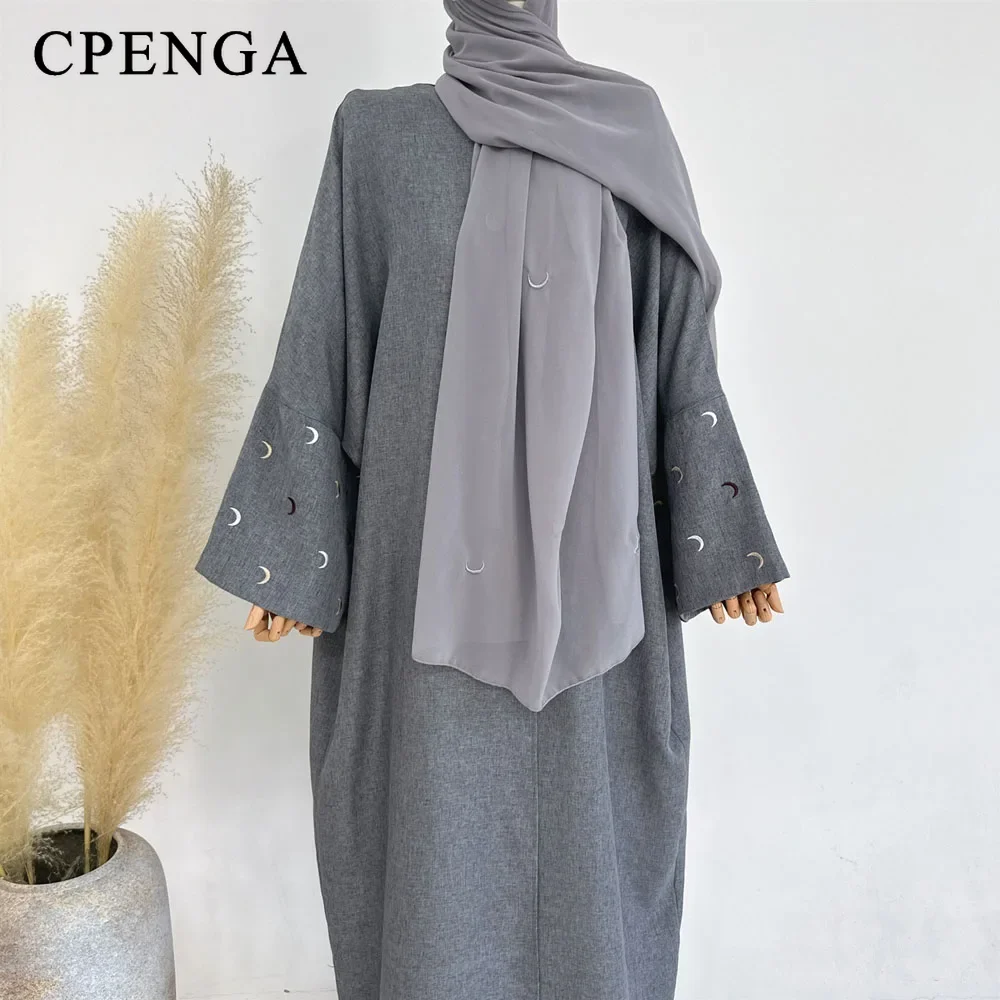 gray coat and hijab