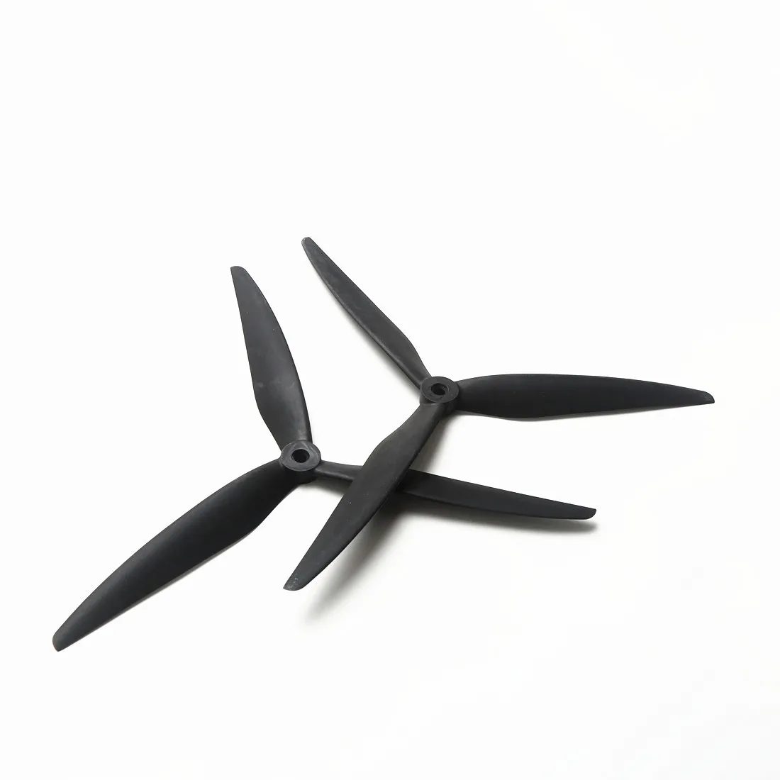 Hélices Drone Course 9 pouces fibre verre nylon, angle latéral mettant en évidence le profil aérodynamique et la fixation centrale.