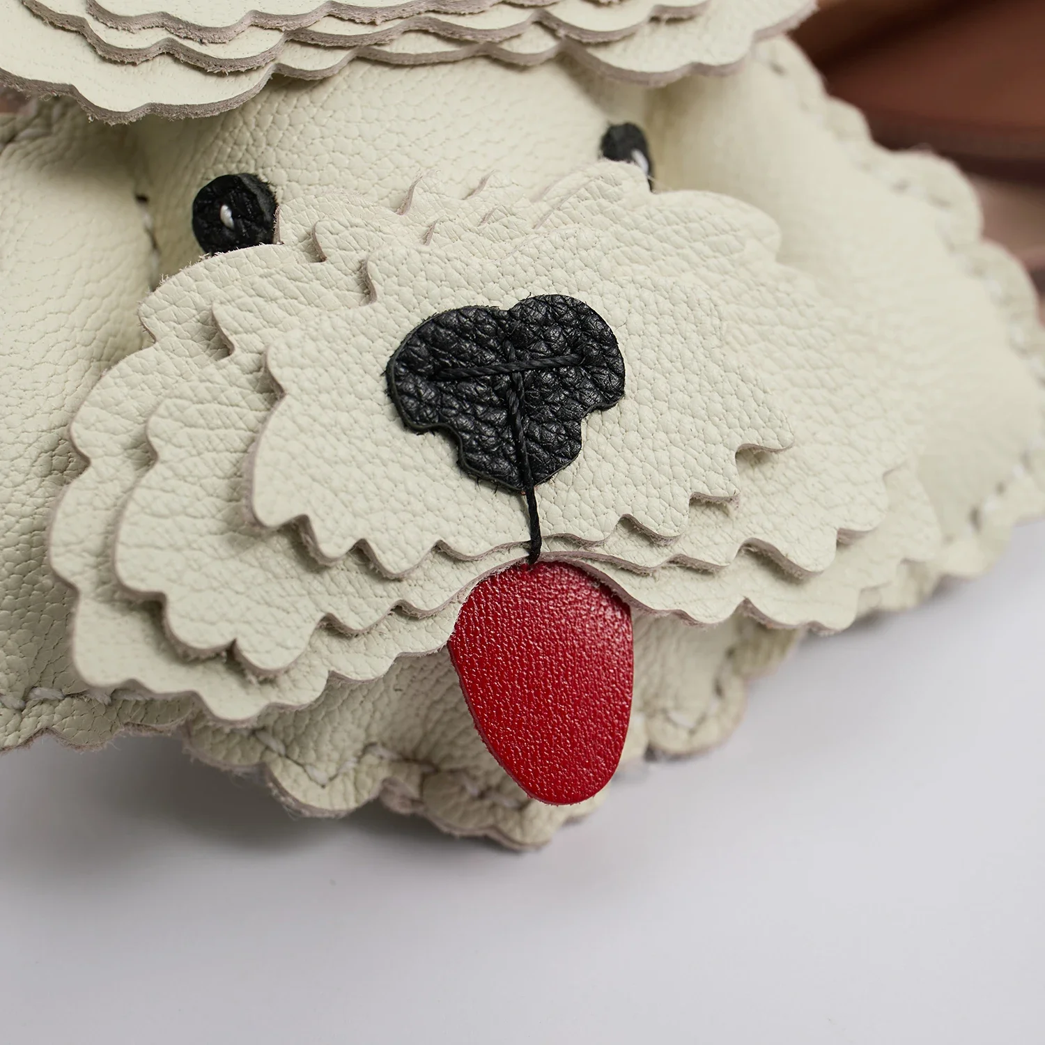 Teddy dog leather charm texture close view