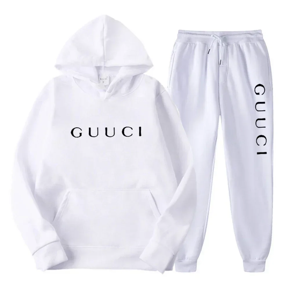 Man wearing autumn streetwear jogging set in urban outdoor setting dark white