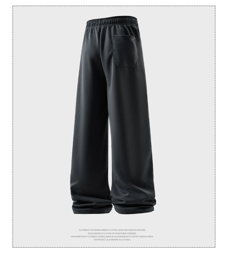 Man wearing loose wide-leg sweatpants with drawstring waist in a casual autumn streetwear setting black 05