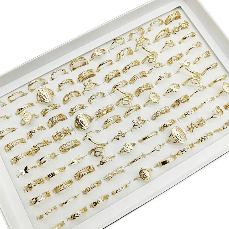 Gold colored rings featuring star and cutout patterns