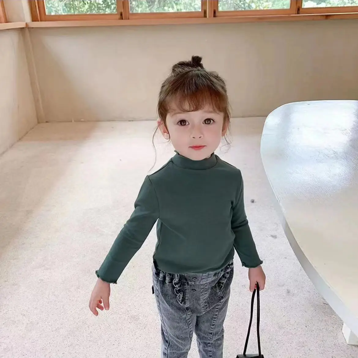 Green girls' base layer top