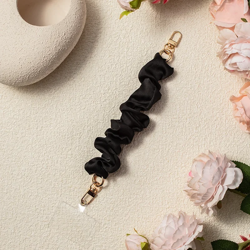 여자를위한 솔리드 컬러 전화 손목 스트랩 팔찌 여자 크리 에이 티브 Stretchable Scrunchy 모양 전화 매는 밧줄 휴대 전화 액세서리