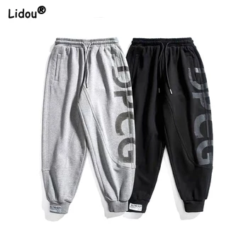 Pantaloni da pendolarismo casual da uomo 2023 autunno e inverno patchwork con stampa di lettere hip-hop tasche con coulisse piedi legati larghi 1