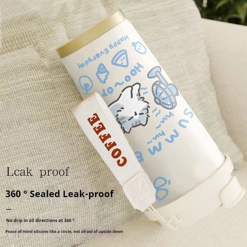 KittyNook Cat Co. Cartoon Kitty Stainless Steel Travel Cup—white, gold lid, "COFFEE" strap, leak-proof, display cushion.