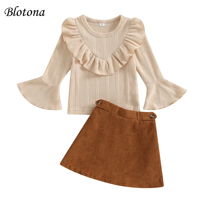 

Blotona Kids Girl Fall Outfits Solid Color Ribbed Ruffled Crew Neck Flare Long Sleeve Tops and Corduroy Skirts 2Pcs Set 4-7Years