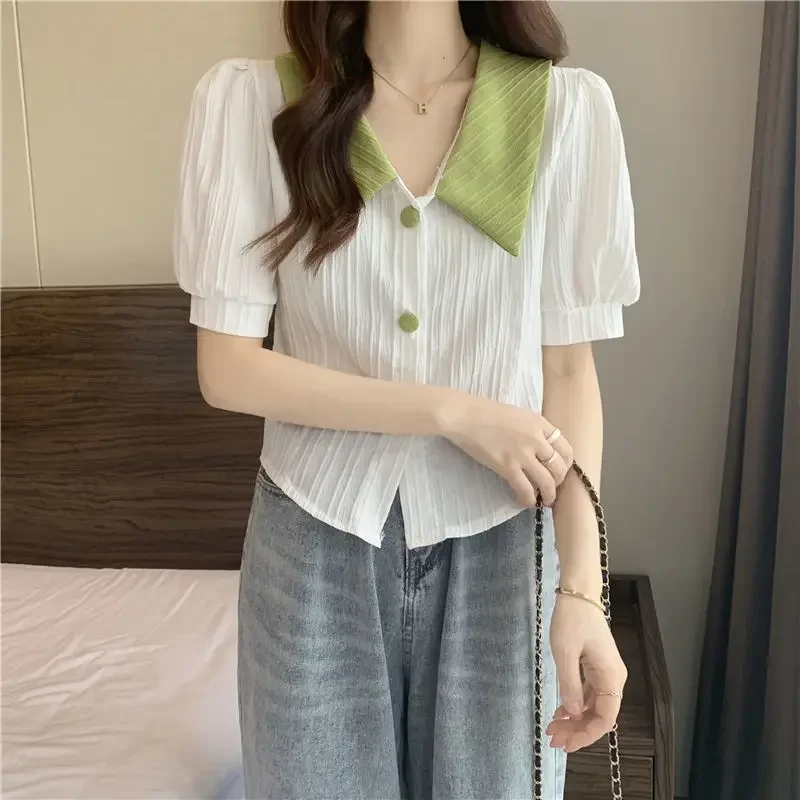 Koreanisches kontrastfarbenes Kurzarmhemd mit Puppenkragen für Frauen im Sommer, neues schickes Hemd-Design, süßes Nischenoberteil – Detail 21