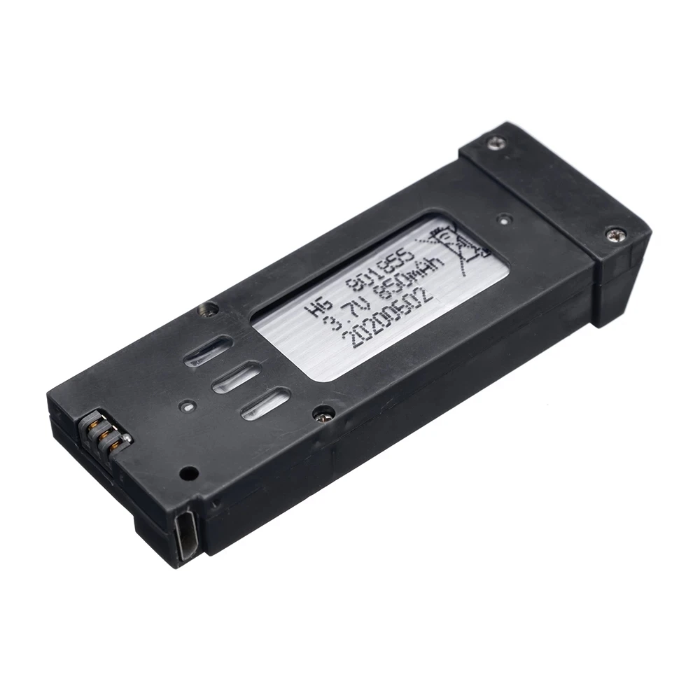 Vue rapprochée d'une batterie de drone, connecteur et câble USB visibles.