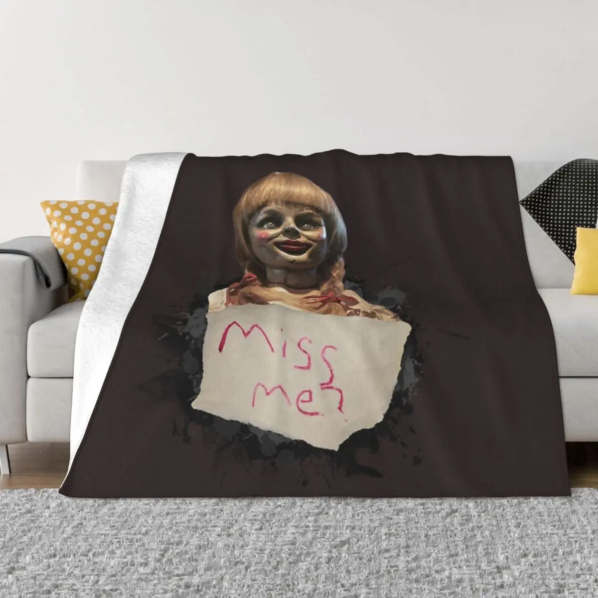 Image of Pink Annabelle doll on bedspread