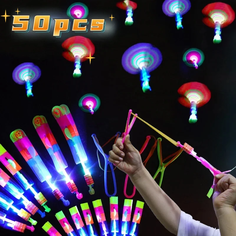 Flying Toy 1/10/30/50pcs Light Toy Arrow Rocket Helicopter Flying Toy LED Light Toys Party Fun Gifts Rubber Band Catapult