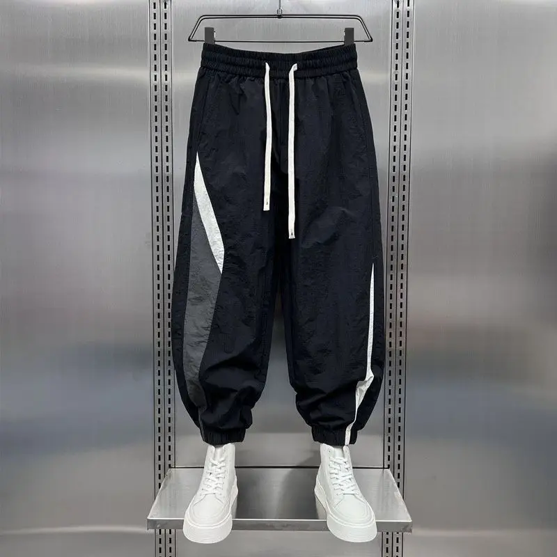 Description Picture 4 of item2024 New Summer Fashion Trendy Men's Casual Sports Style Thin Quick Drying Striped Patchwork Loose and Versatile Harlan Pants