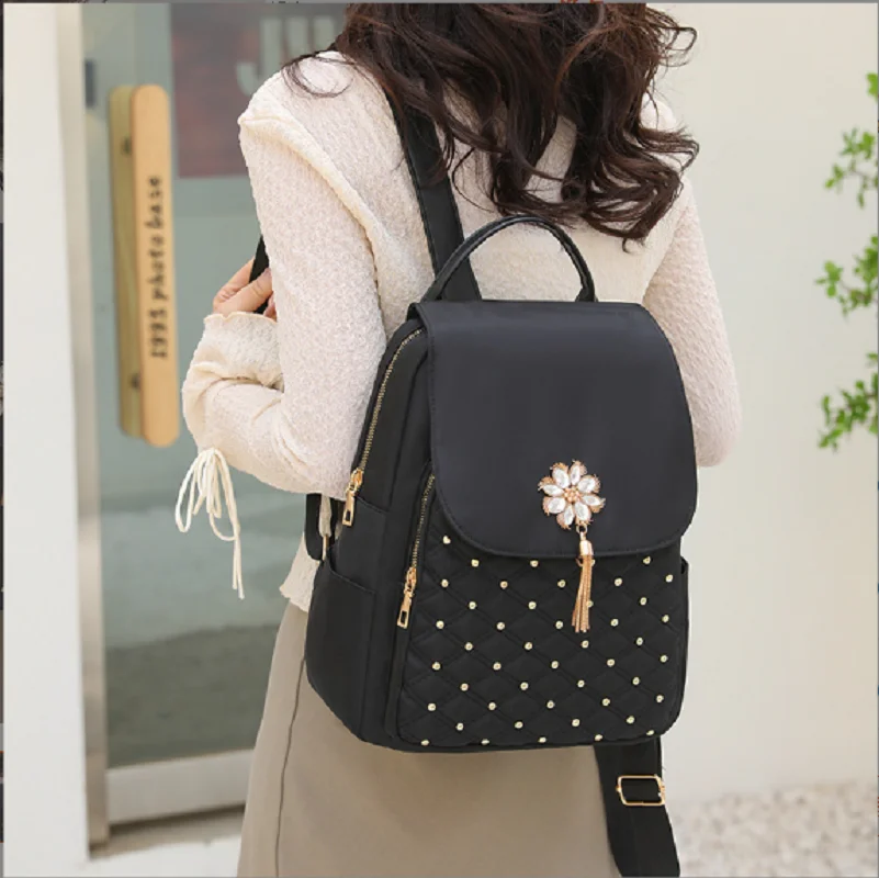 New Fashion Trend Waterproof Oxford Large Capacity Travel Shoulder Bags Laptop School Bag Handbag Women Rivet Tassel Backpack