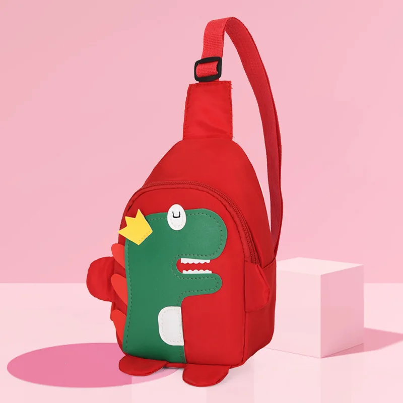 thumbnail image 1 of Bolso de pecho de moda para niños y niñas, bandolera para exteriores, cómoda correa de hombro con decoración de dinosaurio de dibujos animados, nailon transpirable y resistente al agua., 1 of 4
