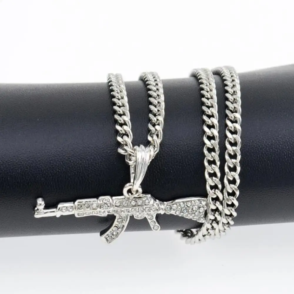 Kiola Designs Gold Toned AK 47 Rifle Necklace | Amazon.com